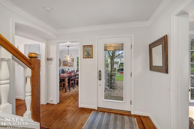 255 Lewiston Rd, Grosse Pointe Farms, MI 48236 - foyer entrance featuring hardwood / wood-style flooring, a chandelier, crown molding, and baseboards