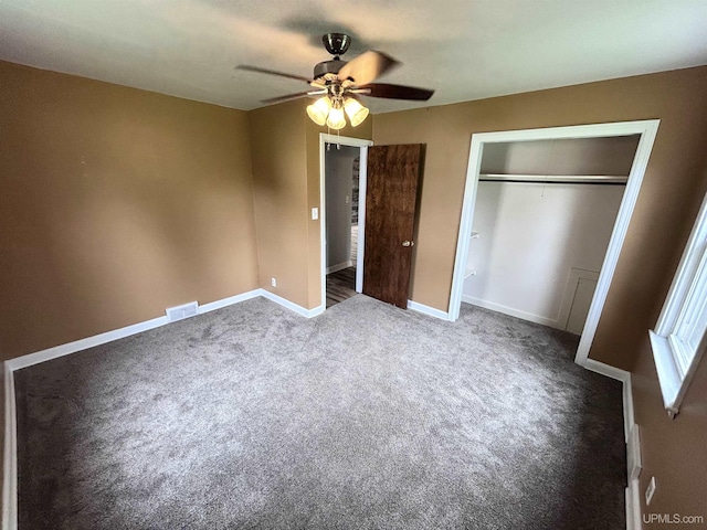 249 E Michigan Ave, Ironwood, MI 49938 - unfurnished bedroom with carpet, a closet, baseboards, and a ceiling fan