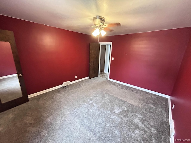 249 E Michigan Ave, Ironwood, MI 49938 - empty room featuring ceiling fan, carpet, and baseboards