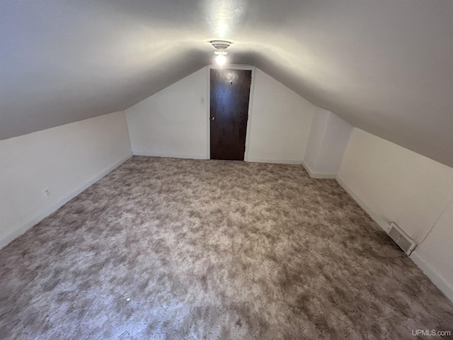 249 E Michigan Ave, Ironwood, MI 49938 - bonus room with carpet, vaulted ceiling, and baseboards