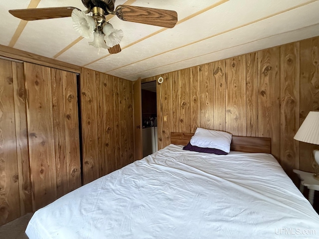 11843 Howen Rd, Long Lake T-Wi, WI 54542 - bedroom featuring wood walls and ceiling fan