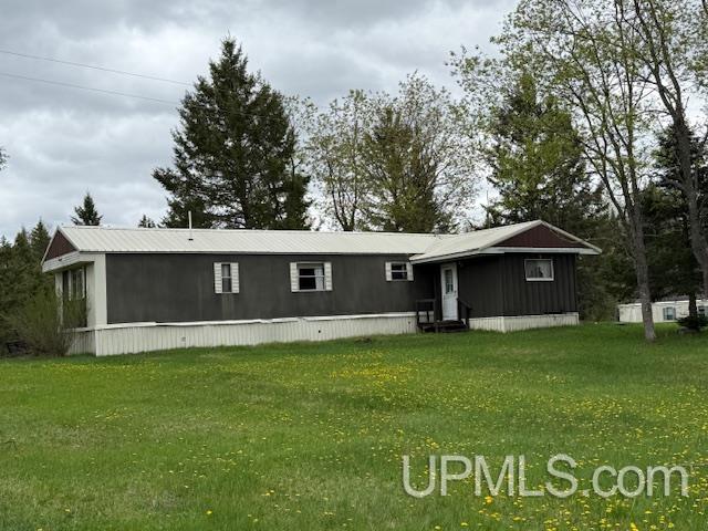 11843 Howen Rd, Long Lake T-Wi, WI 54542 - manufactured / mobile home with entry steps and a front yard