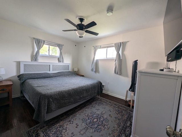 13610 Gander Ave, Warren, MI 48088 - bedroom with dark wood-style floors, multiple windows, baseboards, and ceiling fan