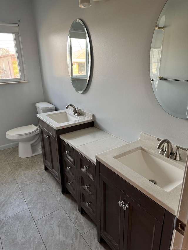 28724 Sutherland Dr, Warren, MI 48088 - bathroom with two vanities and toilet