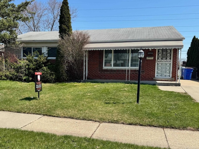 28724 Sutherland Dr, Warren, MI 48088 - view of front of property featuring brick siding and a front lawn