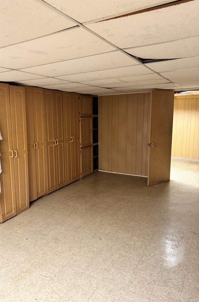 28724 Sutherland Dr, Warren, MI 48088 - finished basement featuring wood walls, a drop ceiling, and light flooring