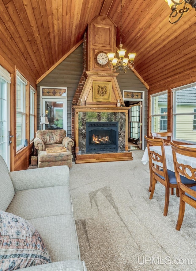 1128 E E St, Iron Mountain, MI 49801 - living room with wooden ceiling, lofted ceiling, a chandelier, wooden walls, and carpet flooring