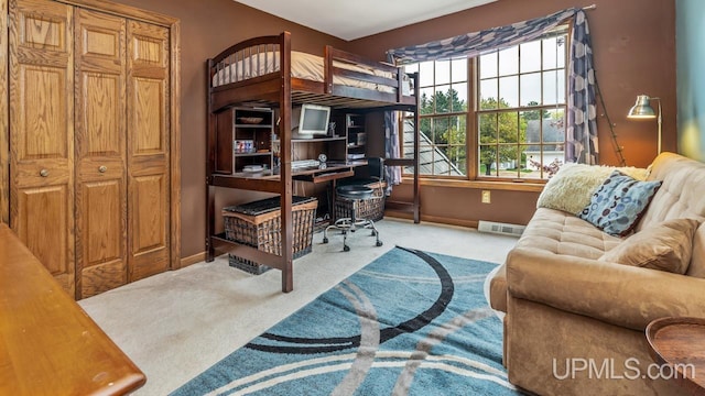 1128 E E St, Iron Mountain, MI 49801 - carpeted bedroom with baseboards and a desk