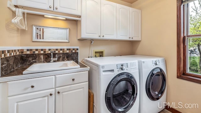 1128 E E St, Iron Mountain, MI 49801 - laundry area with cabinet space and independent washer and dryer