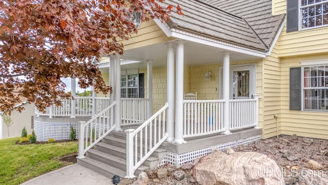 1128 E E St, Iron Mountain, MI 49801 - view of exterior entry featuring covered porch