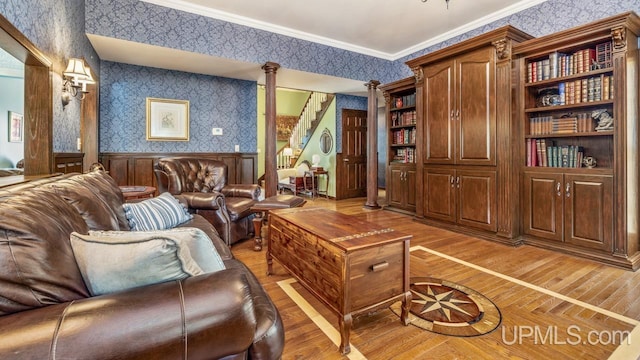 1128 E E St, Iron Mountain, MI 49801 - living area featuring wallpapered walls, wainscoting, light wood-style flooring, ornamental molding, and stairs