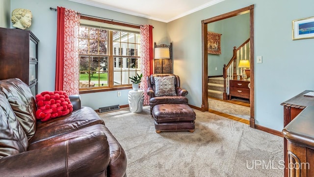 1128 E E St, Iron Mountain, MI 49801 - sitting room featuring baseboards, ornamental molding, carpet flooring, and stairway