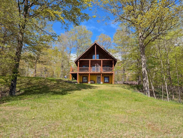 4537 Ii Rd, Garden, MI 49835 - rear view of house featuring a wooden deck and a yard