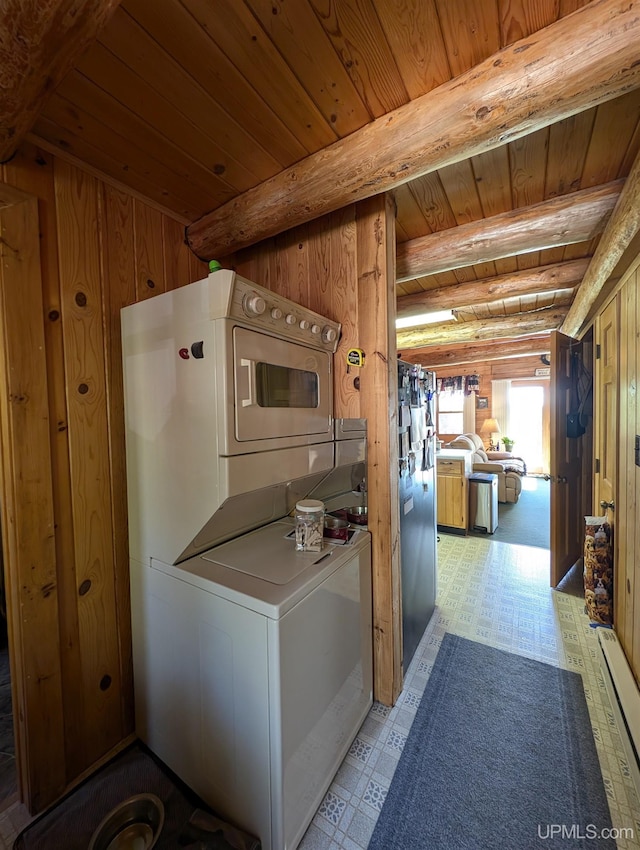 4537 Ii Rd, Garden, MI 49835 - laundry area with stacked washing machine and dryer, wood ceiling, light flooring, a baseboard heating unit, and wooden walls