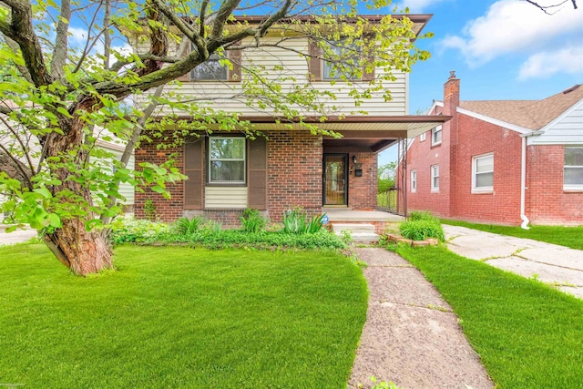 20681 Beaufait St, Harper Woods, MI 48225 - view of front of home featuring brick siding, a front yard, and a porch