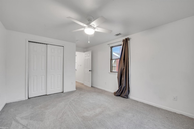 20681 Beaufait St, Harper Woods, MI 48225 - unfurnished bedroom with carpet floors, a closet, baseboards, and a ceiling fan
