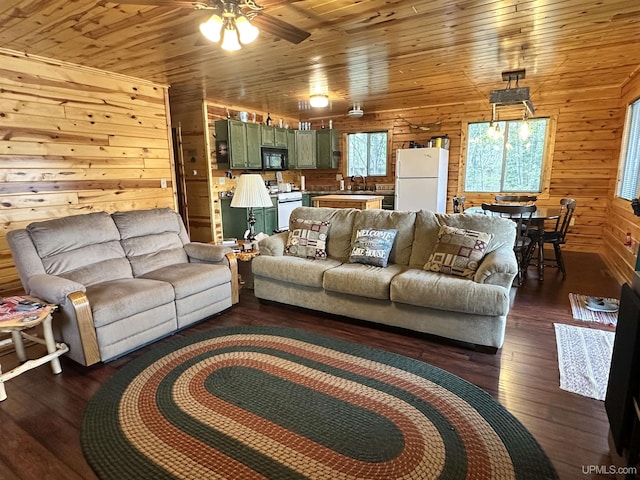 2966 Sycamore Ln, Republic, MI 49879 - living area with wooden walls, ceiling fan, dark wood-style floors, and wooden ceiling