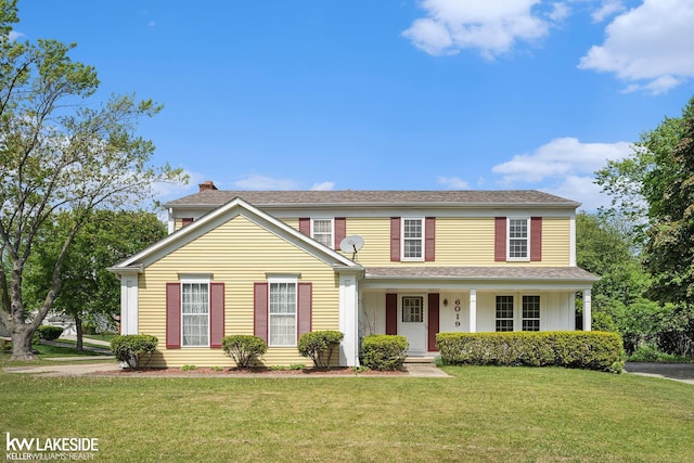 6019 Kingsfield Dr, West Bloomfield, MI 48322 - traditional home featuring a front yard, a chimney, and covered porch
