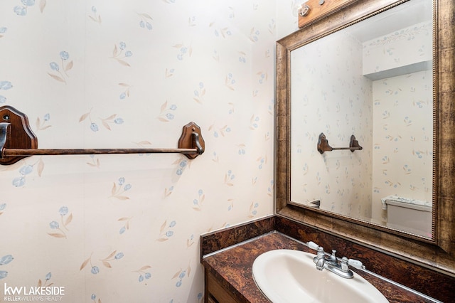 6019 Kingsfield Dr, West Bloomfield, MI 48322 - half bathroom featuring vanity and wallpapered walls
