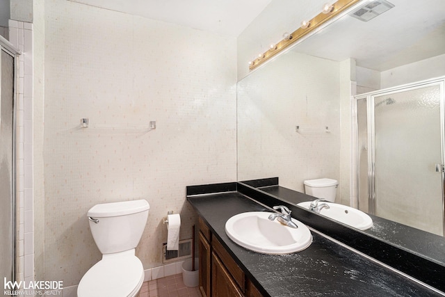 6019 Kingsfield Dr, West Bloomfield, MI 48322 - bathroom with toilet, vanity, a stall shower, tile walls, and tile patterned floors