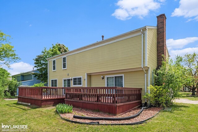 6019 Kingsfield Dr, West Bloomfield, MI 48322 - back of house featuring a chimney, a lawn, and a deck