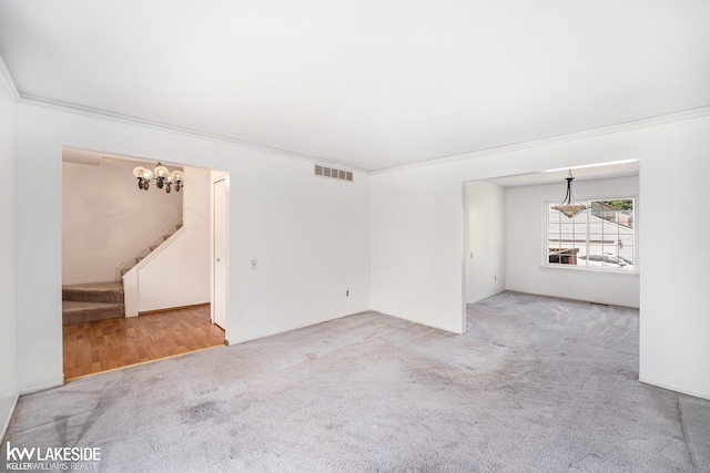6019 Kingsfield Dr, West Bloomfield, MI 48322 - unfurnished room featuring carpet floors, crown molding, a chandelier, and stairs