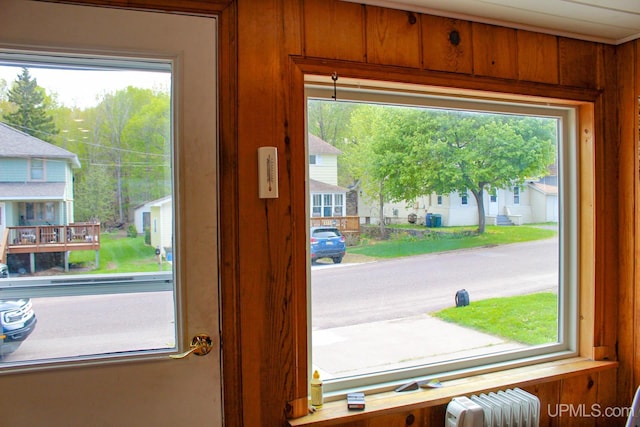 19390 W Calverley St, Houghton, MI 49931 - detailed view of radiator heating unit and wood walls