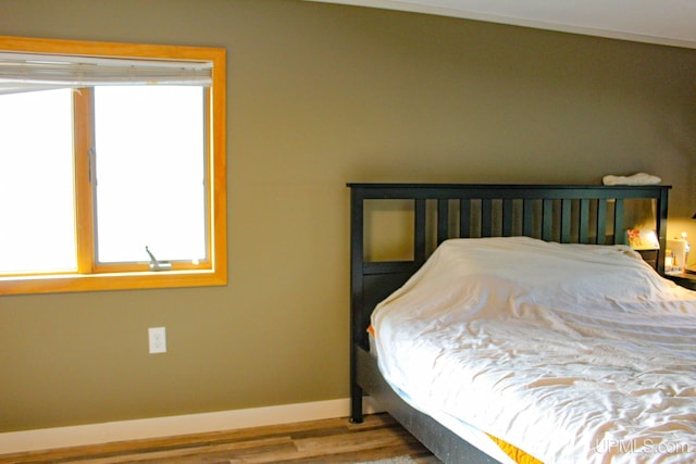 19390 W Calverley St, Houghton, MI 49931 - bedroom featuring wood finished floors and baseboards