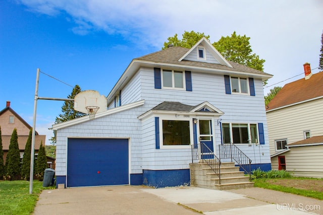 19390 W Calverley St, Houghton, MI 49931 - traditional style home with concrete driveway, a garage, and a shingled roof