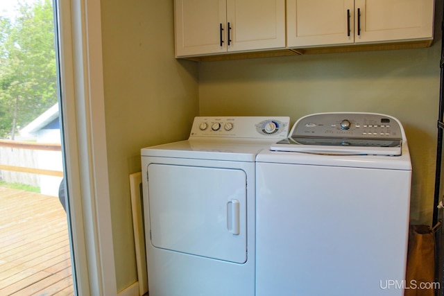 19390 W Calverley St, Houghton, MI 49931 - washroom featuring washer and clothes dryer and cabinet space