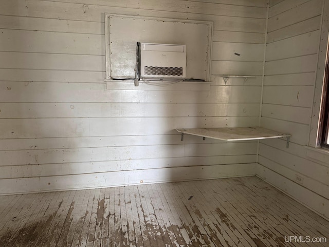 2003 Center St, Marquette, MI 49855 - unfurnished room featuring wood walls and hardwood / wood-style floors