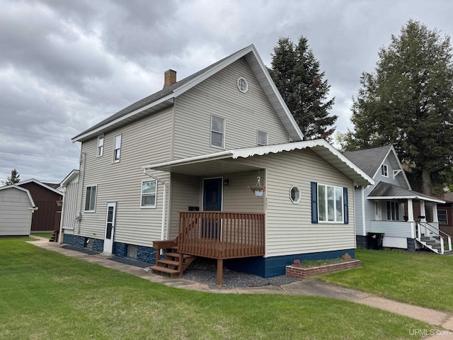 809 W A St, Iron Mountain, MI 49801 - rear view of property featuring a chimney and a yard