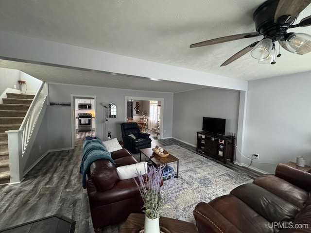809 W A St, Iron Mountain, MI 49801 - living room with baseboards, stairway, wood finished floors, ceiling fan, and a textured ceiling