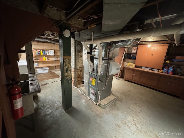 809 W A St, Iron Mountain, MI 49801 - unfinished basement featuring heating unit