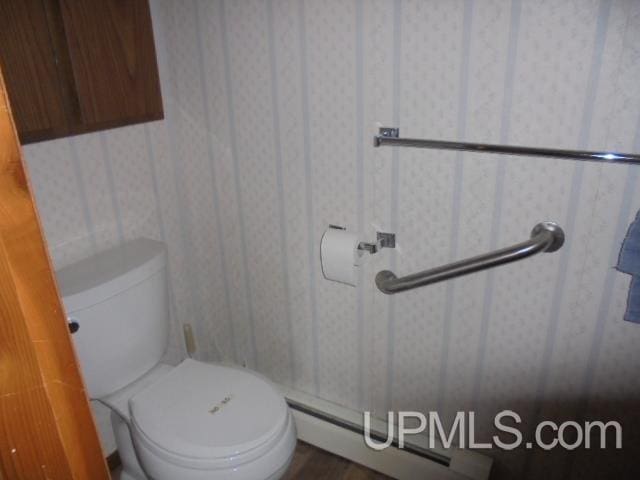 605 W 5th St, Rockland, MI 49960 - bathroom with toilet, wallpapered walls, and wood finished floors