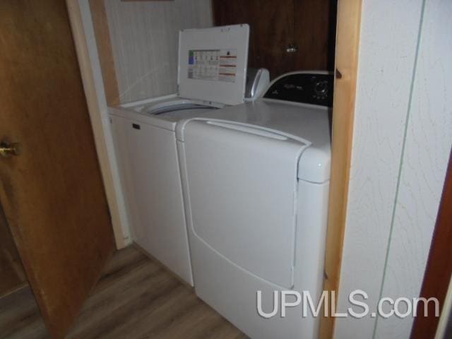605 W 5th St, Rockland, MI 49960 - washroom featuring independent washer and dryer and light wood finished floors