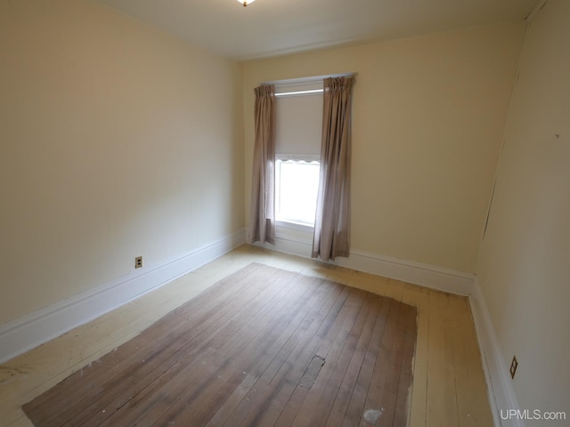 708 Calumet St, Lake Linden, MI 49945 - unfurnished room featuring wood-type flooring and baseboards
