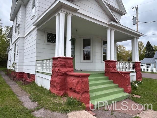 708 Calumet St, Lake Linden, MI 49945 - entrance to property featuring a porch