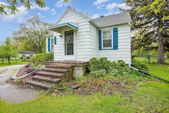 107 State Park Dr, Bay City, MI 48706 - view of front of home with a shingled roof