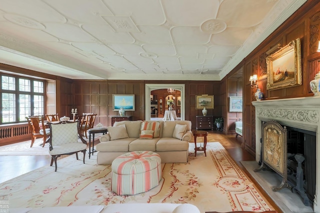 257 Ridge Rd, Grosse Pointe Farms, MI 48236 - living area featuring light wood-type flooring, a fireplace, and arched walkways