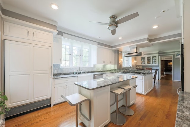 257 Ridge Rd, Grosse Pointe Farms, MI 48236 - kitchen featuring a center island, dishwasher, a ceiling fan, a sink, and light wood-type flooring