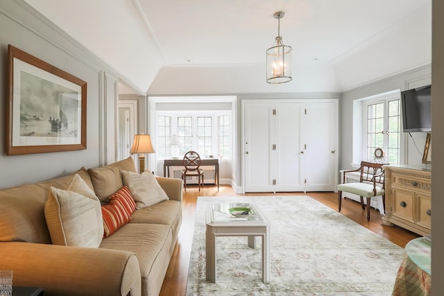257 Ridge Rd, Grosse Pointe Farms, MI 48236 - living area featuring lofted ceiling, light wood-style flooring, and a chandelier