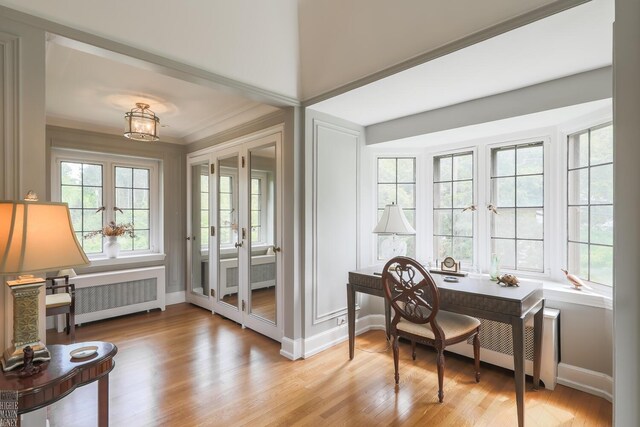 257 Ridge Rd, Grosse Pointe Farms, MI 48236 - office area with radiator heating unit, light wood finished floors, baseboards, and french doors