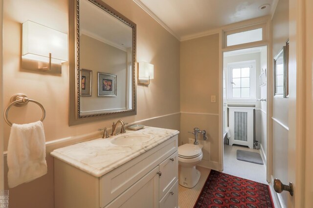 257 Ridge Rd, Grosse Pointe Farms, MI 48236 - bathroom featuring radiator, vanity, toilet, and ornamental molding
