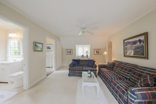 257 Ridge Rd, Grosse Pointe Farms, MI 48236 - living room with a ceiling fan, healthy amount of natural light, ornamental molding, arched walkways, and baseboards