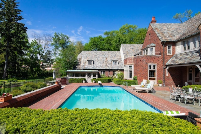 257 Ridge Rd, Grosse Pointe Farms, MI 48236 - view of swimming pool featuring a patio area and a diving board