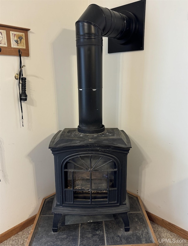 7848 Cole St, Rapid River, MI 49878 - detailed view of a wood stove and baseboards