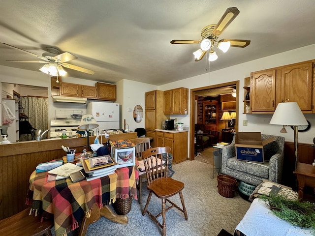7848 Cole St, Rapid River, MI 49878 - dining area featuring ceiling fan and light colored carpet