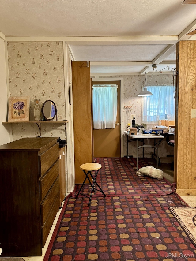 7848 Cole St, Rapid River, MI 49878 - interior space featuring wallpapered walls and beamed ceiling