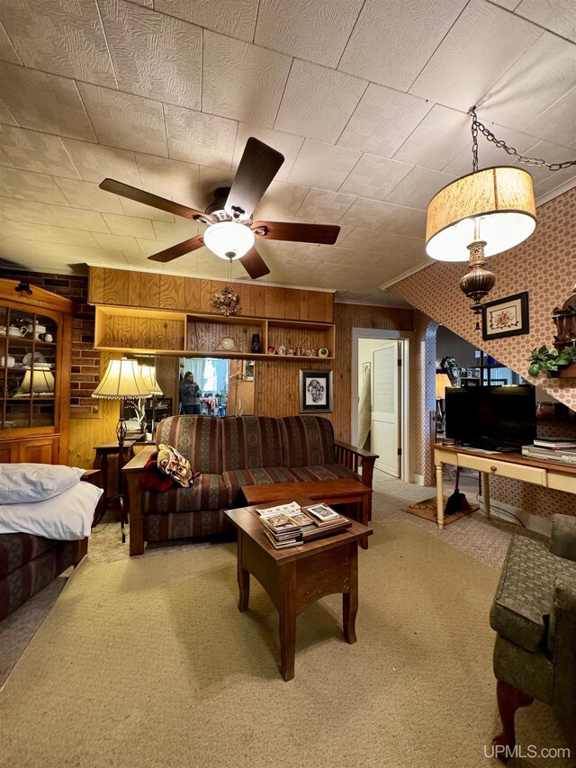7848 Cole St, Rapid River, MI 49878 - living room featuring carpet flooring, wood walls, and ceiling fan